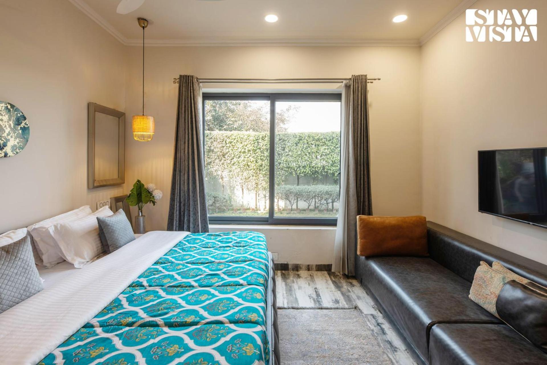 Stayvista's Velvet Whisper - Urban Retreat With Contemporary Decor, Cozy Balcony & Lawn *